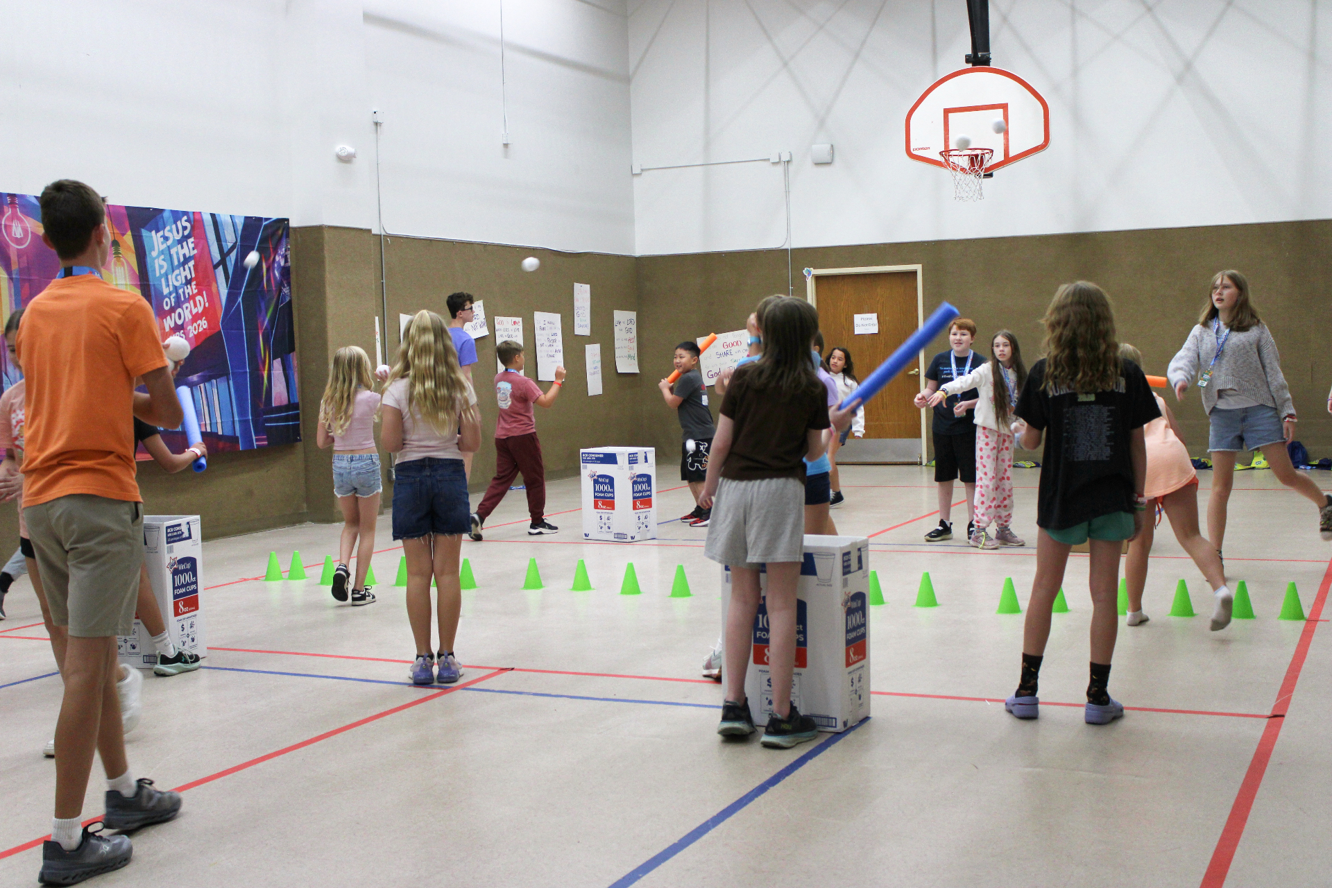 Children playing games together in the gym during VBS